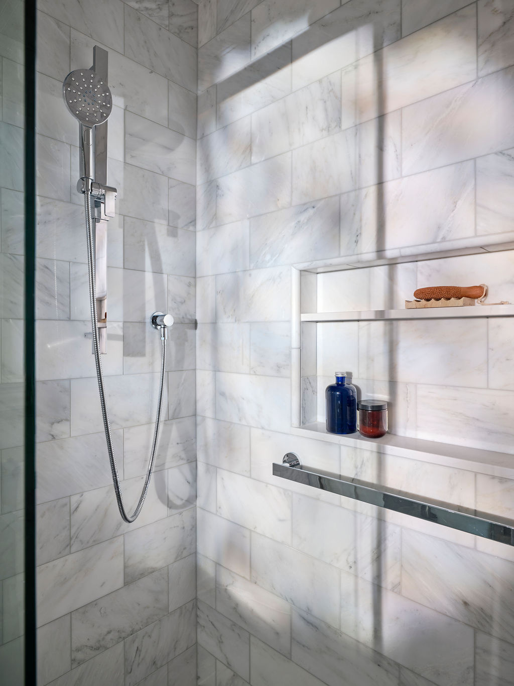 adu bathroom walk in shower with tiled walls and niche by mak design build in davis ca