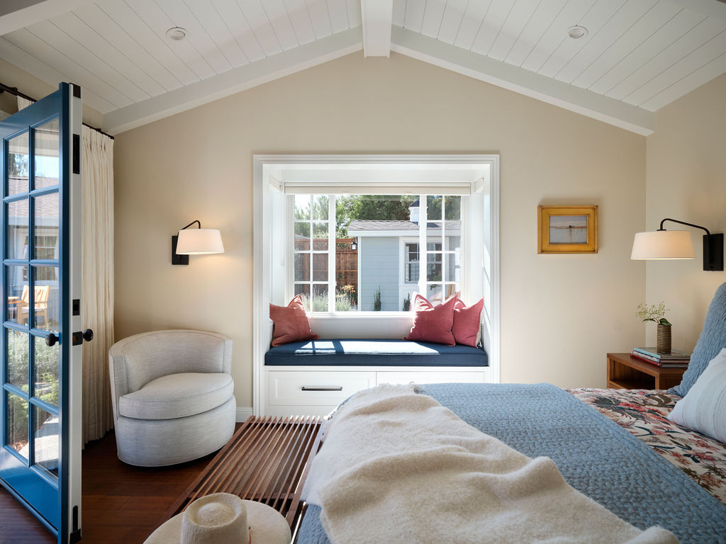 adu bedroom with vaulted ceiling bay window and reading chair by mak design build in davis ca
