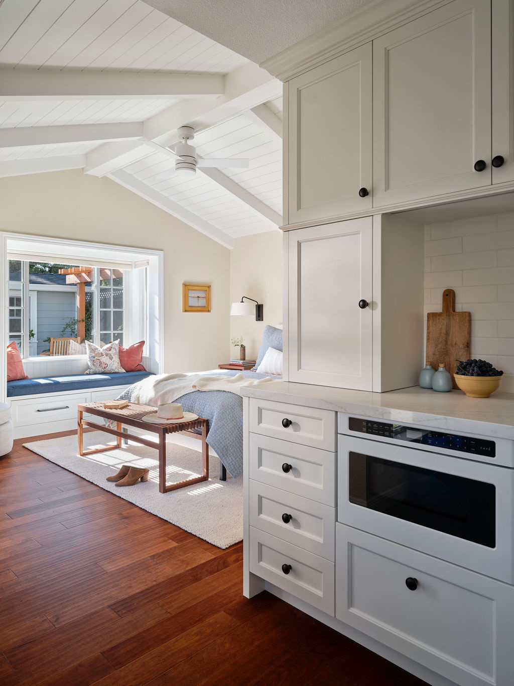 adu kitchenette with white cabinetry and bedroom view by mak design build in davis ca